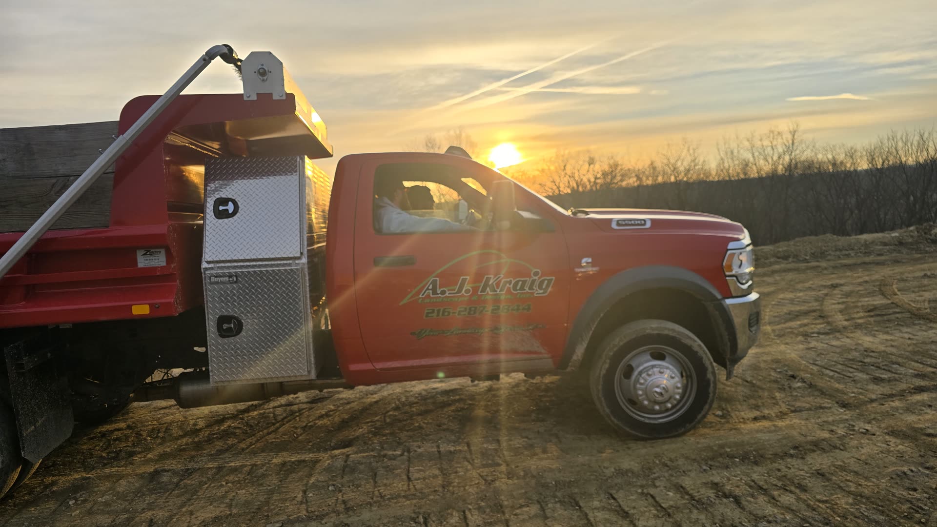 A.J. Kraig Landscape and Design work truck at sunset