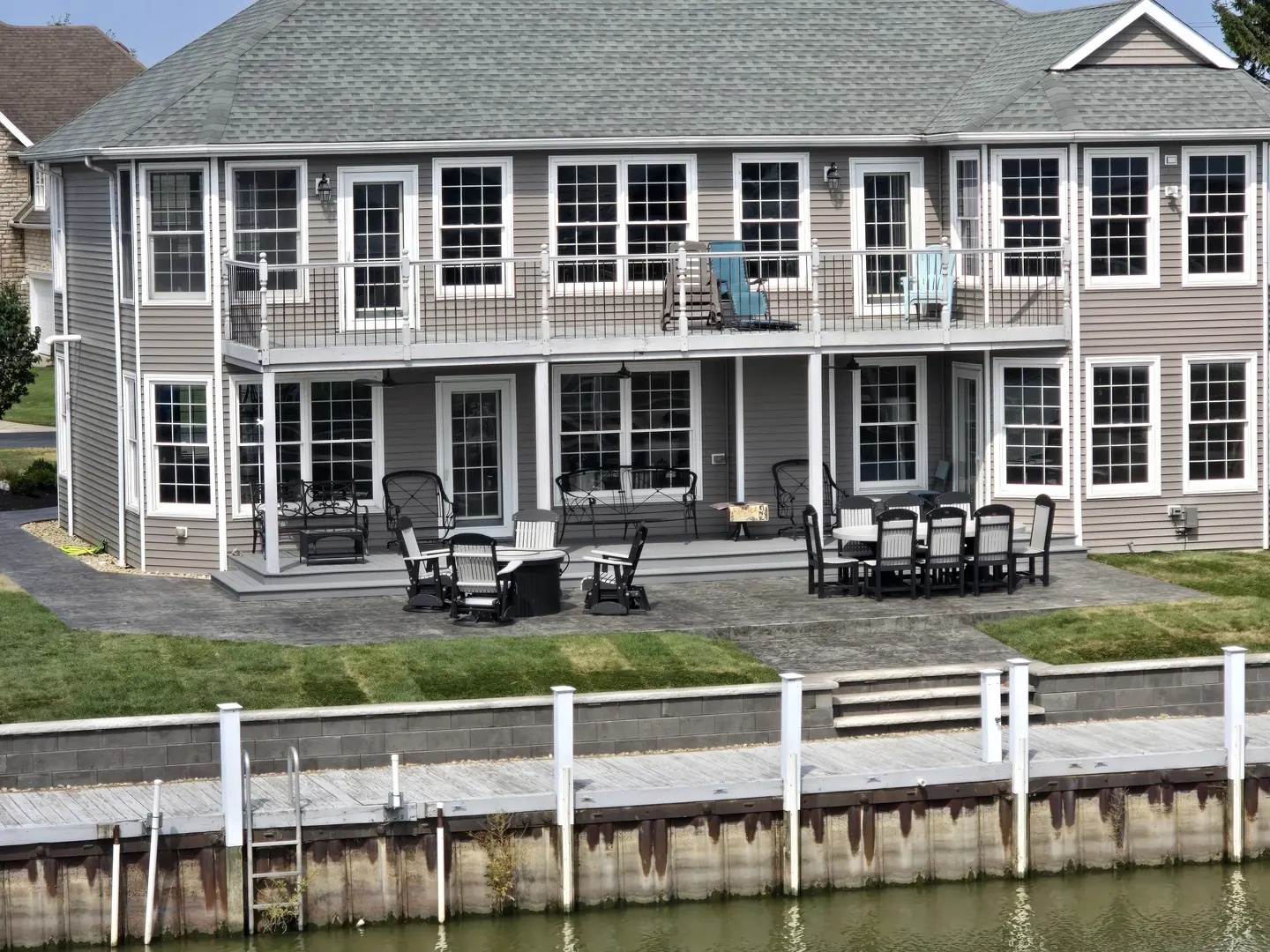 Wide view of a finished waterfront backyard landscape