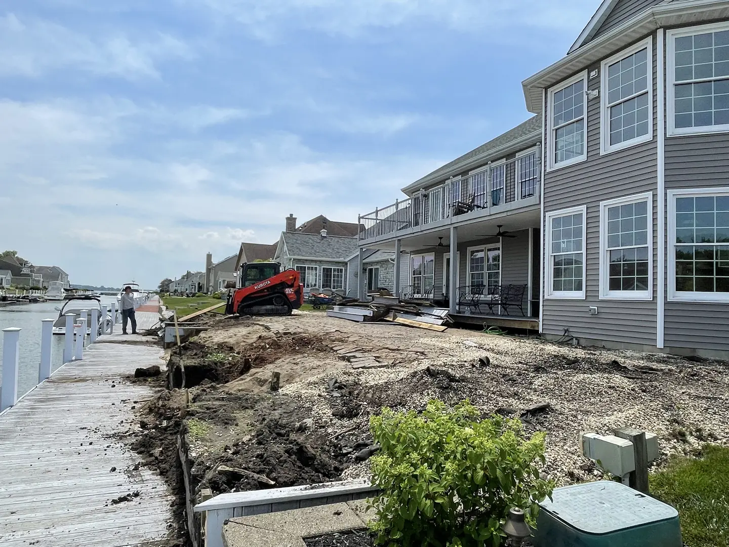 Waterfront retaining wall and backyard during construction