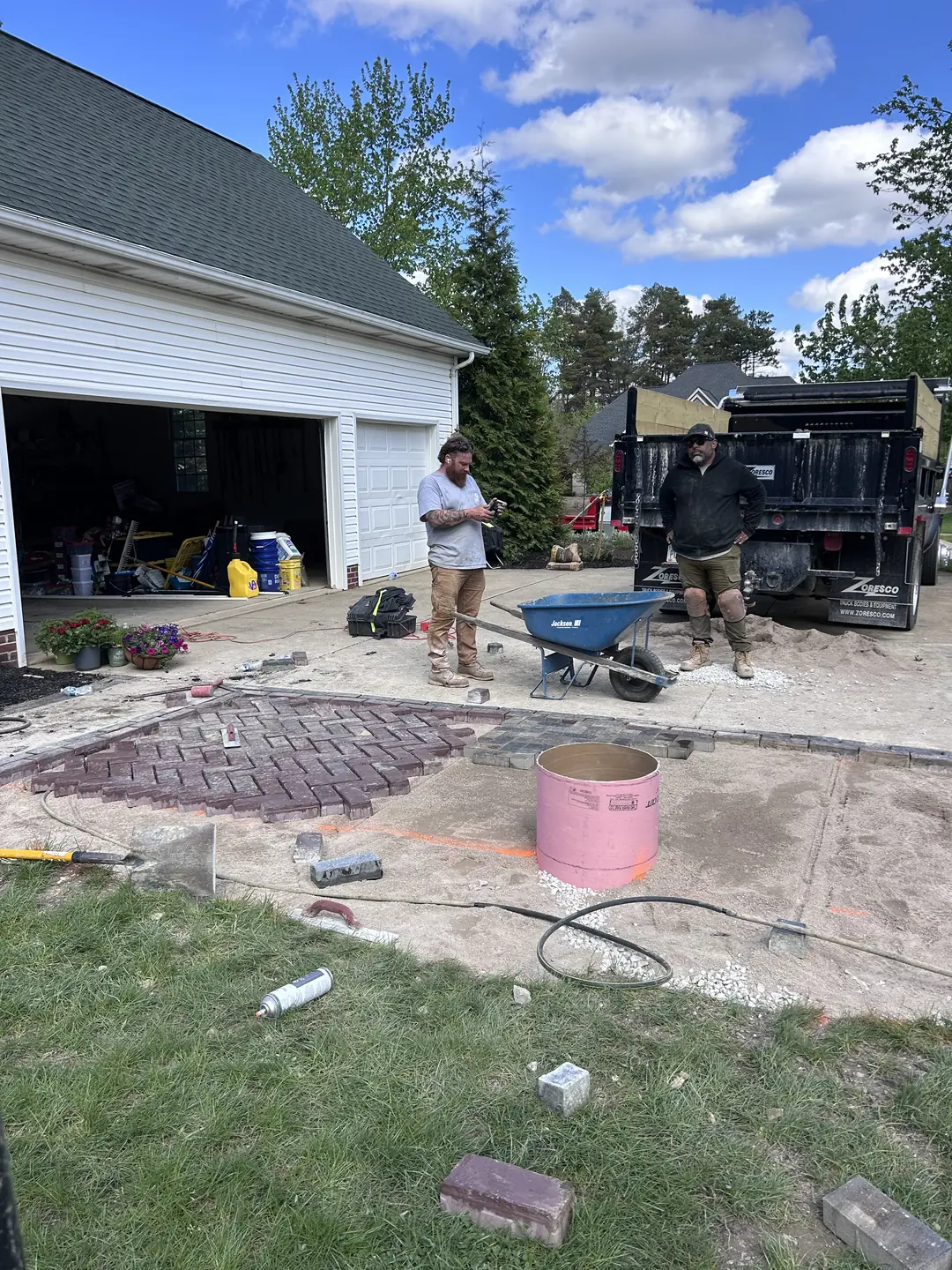 Drainage, excavation, and base preparation on an active job site