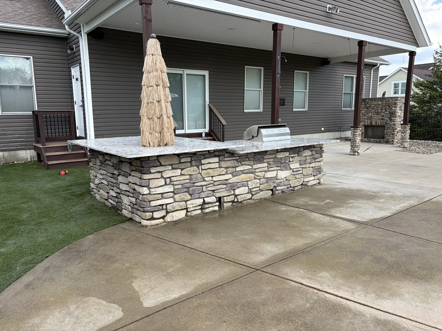 Stone outdoor kitchen and patio construction detail