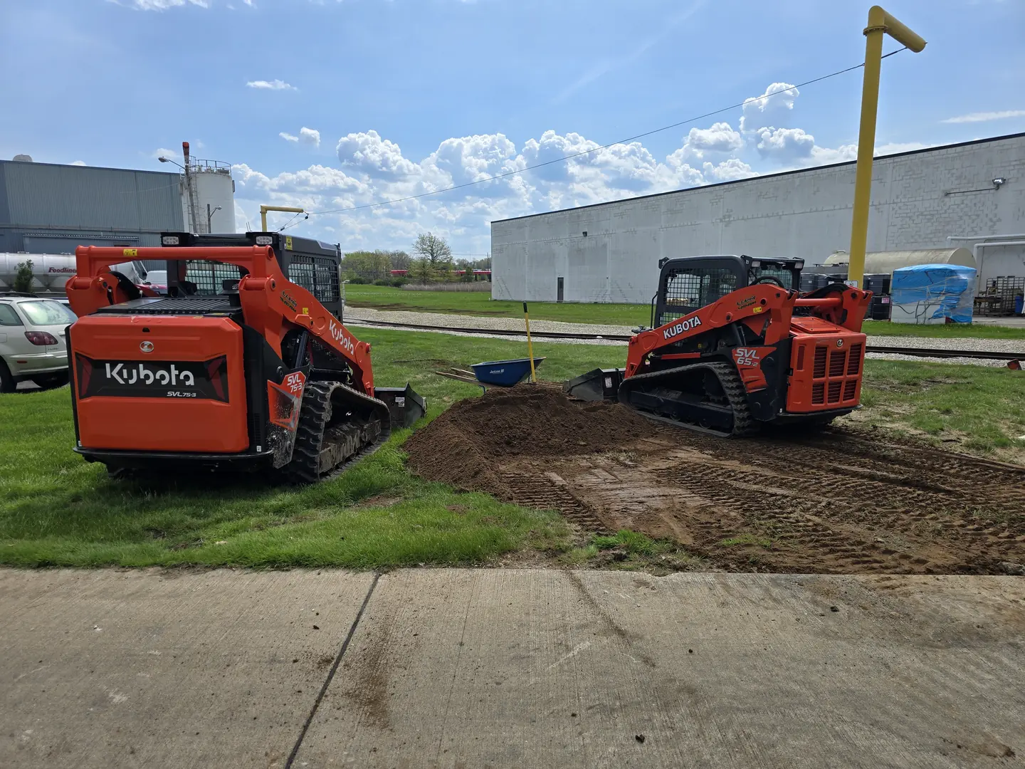 Drainage, excavation, and base preparation on an active job site