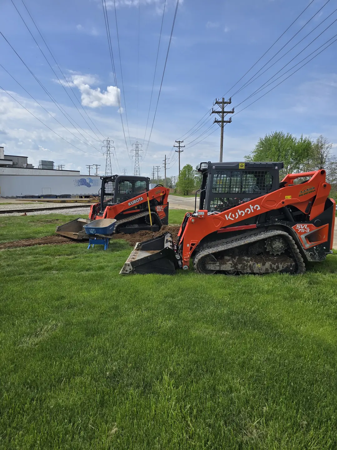 Drainage, excavation, and base preparation on an active job site