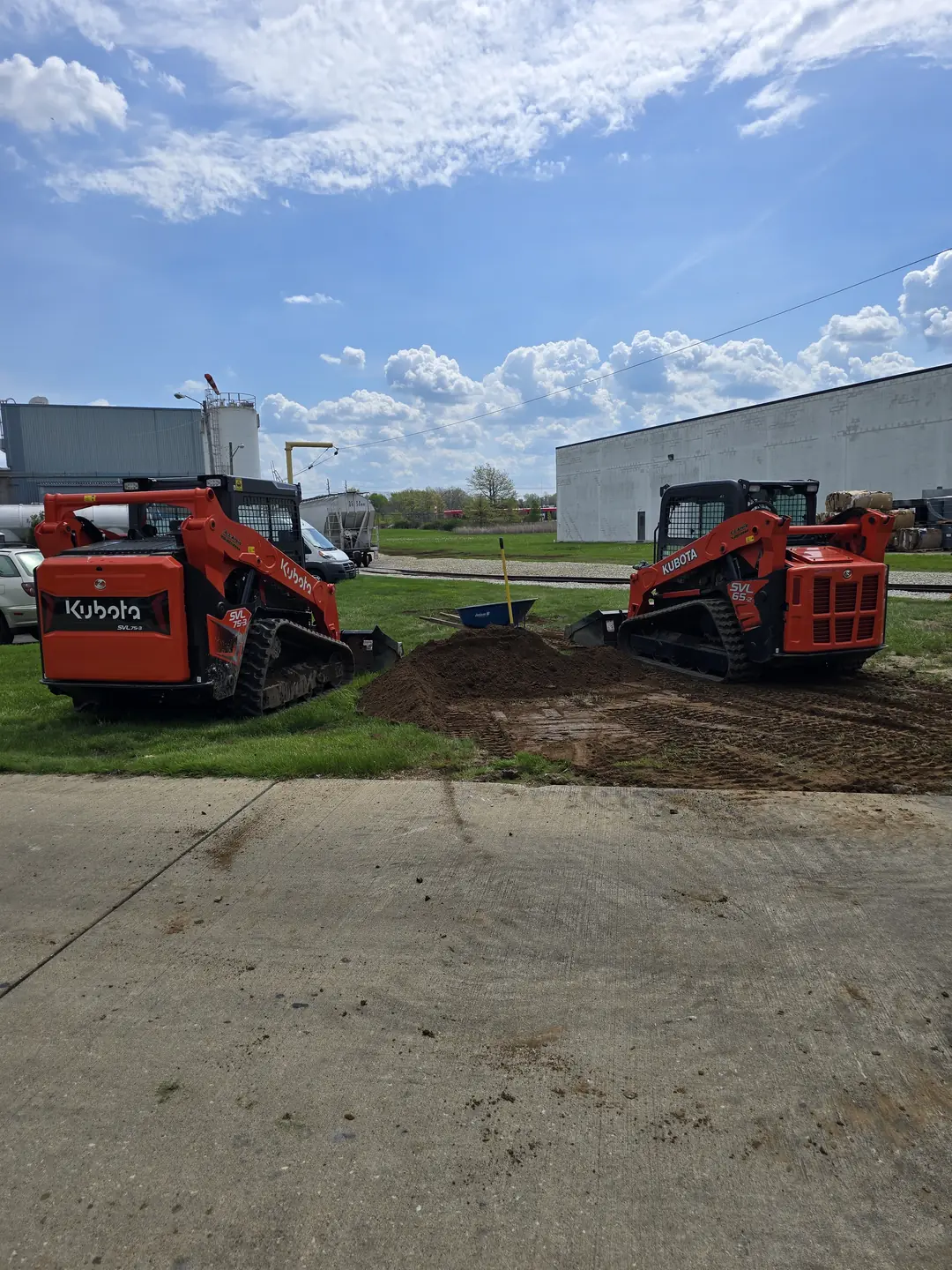 Drainage, excavation, and base preparation on an active job site
