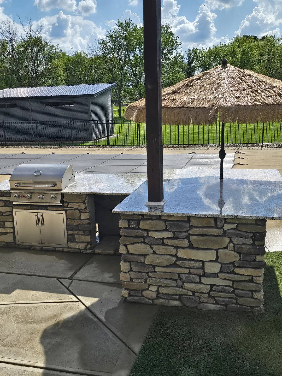 Stone outdoor kitchen and patio construction detail