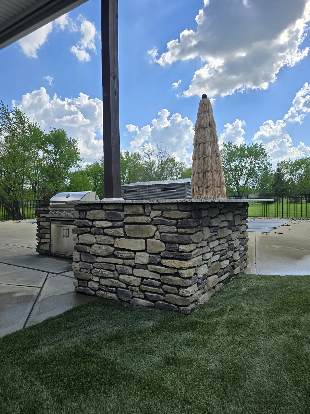 Stone outdoor kitchen and patio construction detail