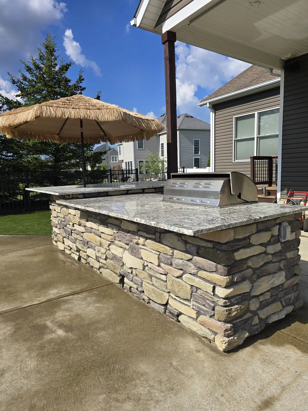 Stone outdoor kitchen and patio construction detail