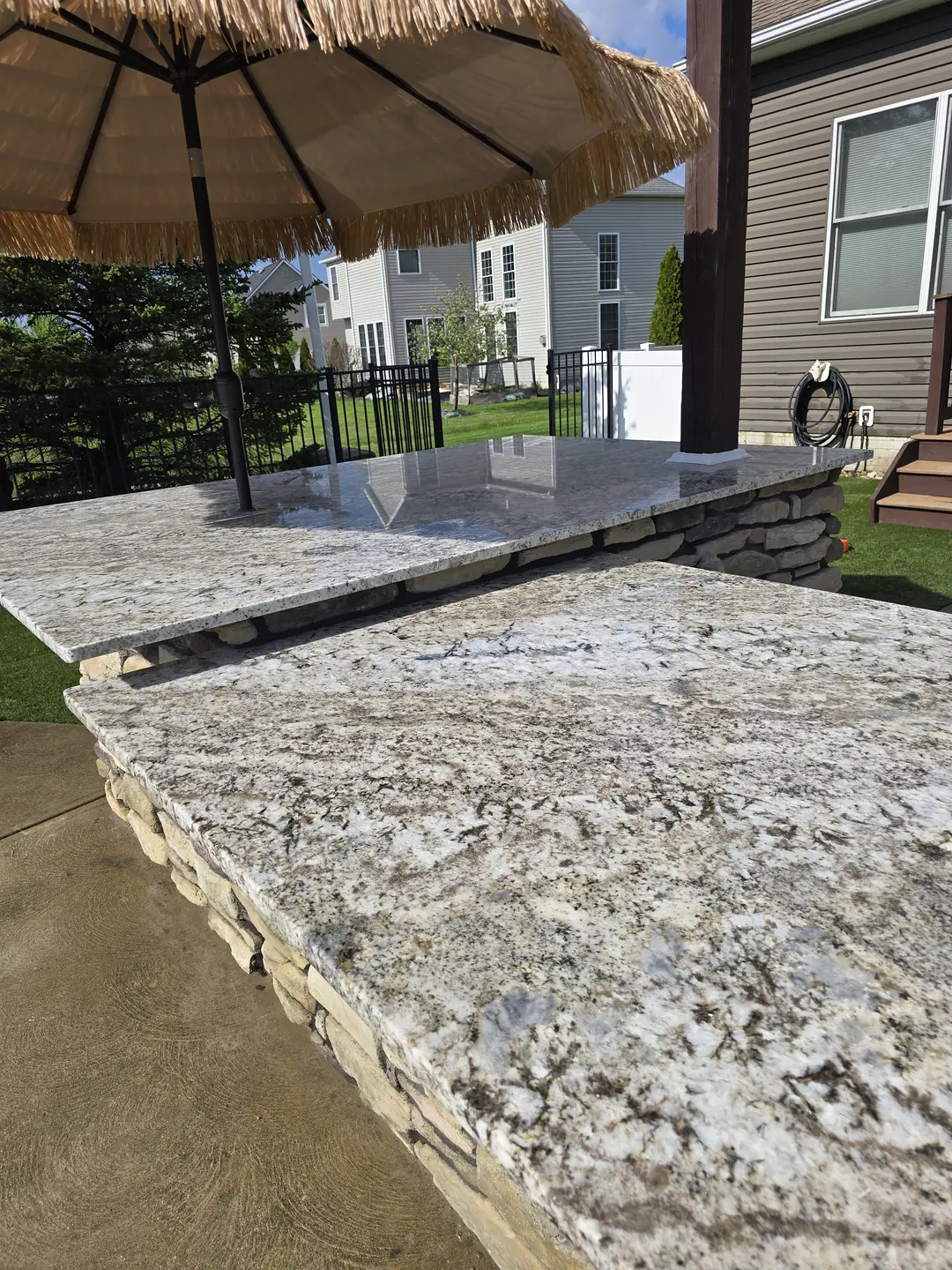 Stone outdoor kitchen and patio construction detail