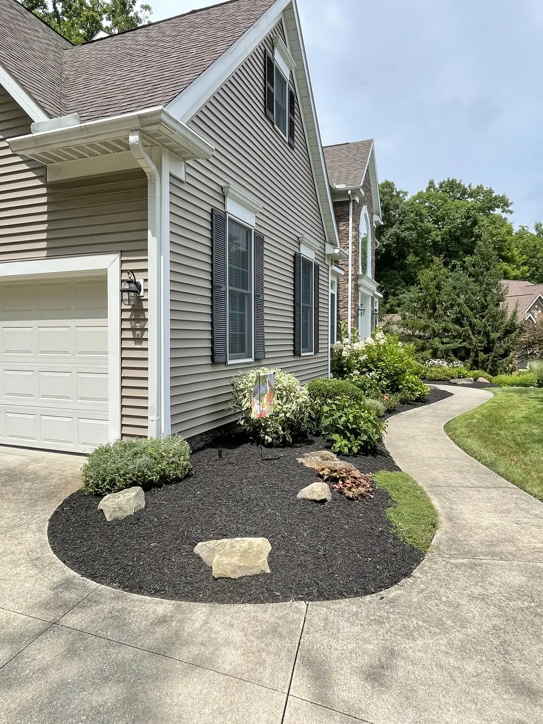 Freshly edged and mulched residential landscape bed