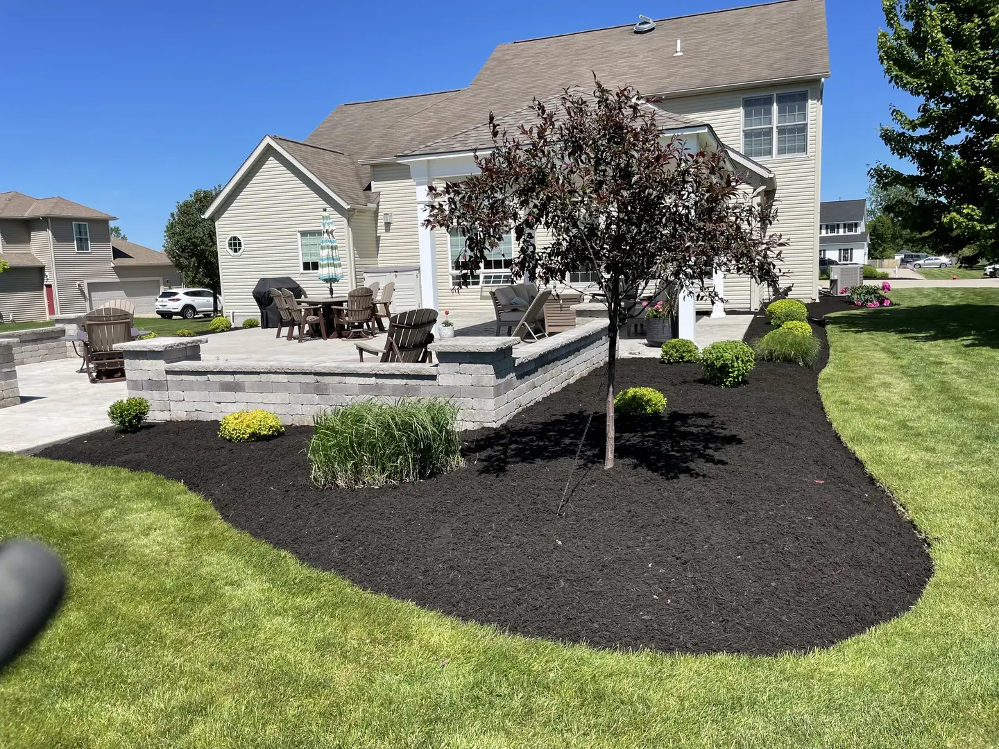 Freshly edged and mulched residential landscape bed