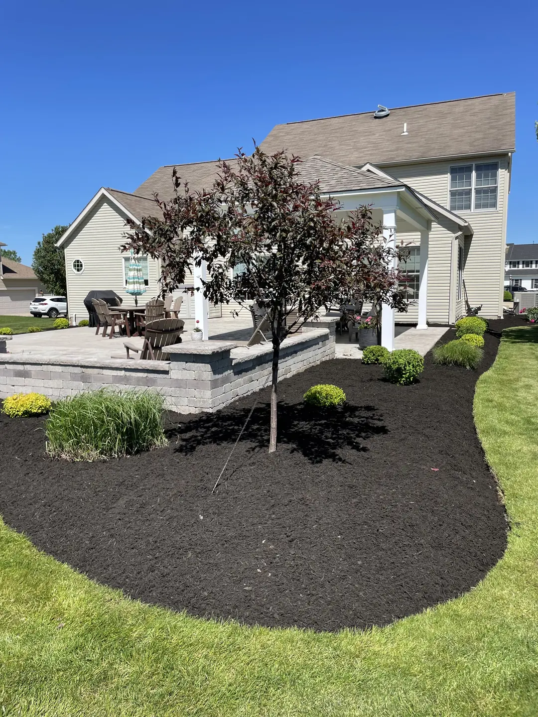 Freshly edged and mulched residential landscape bed