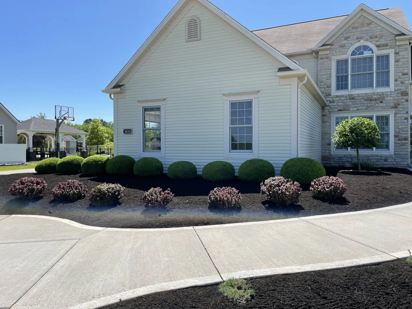 Freshly edged and mulched residential landscape bed