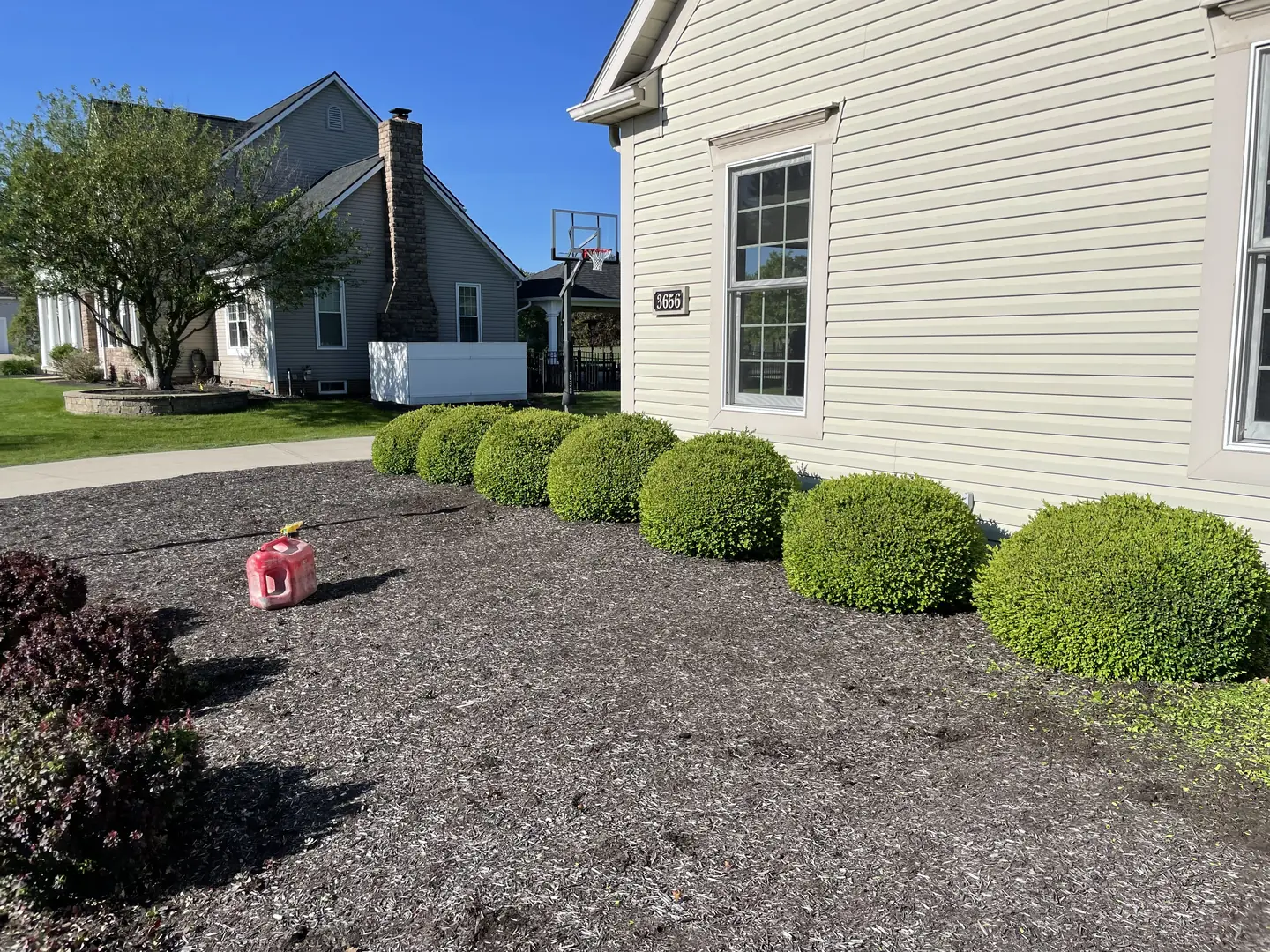 Freshly edged and mulched residential landscape bed