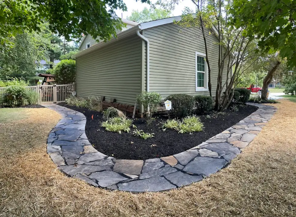 Flagstone walkway along side of house