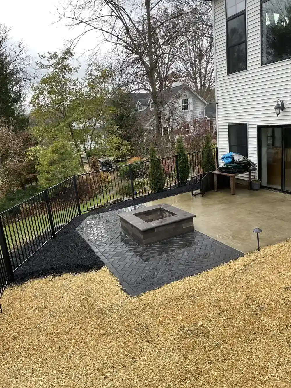 Paver patio with fire pit and aluminum railing