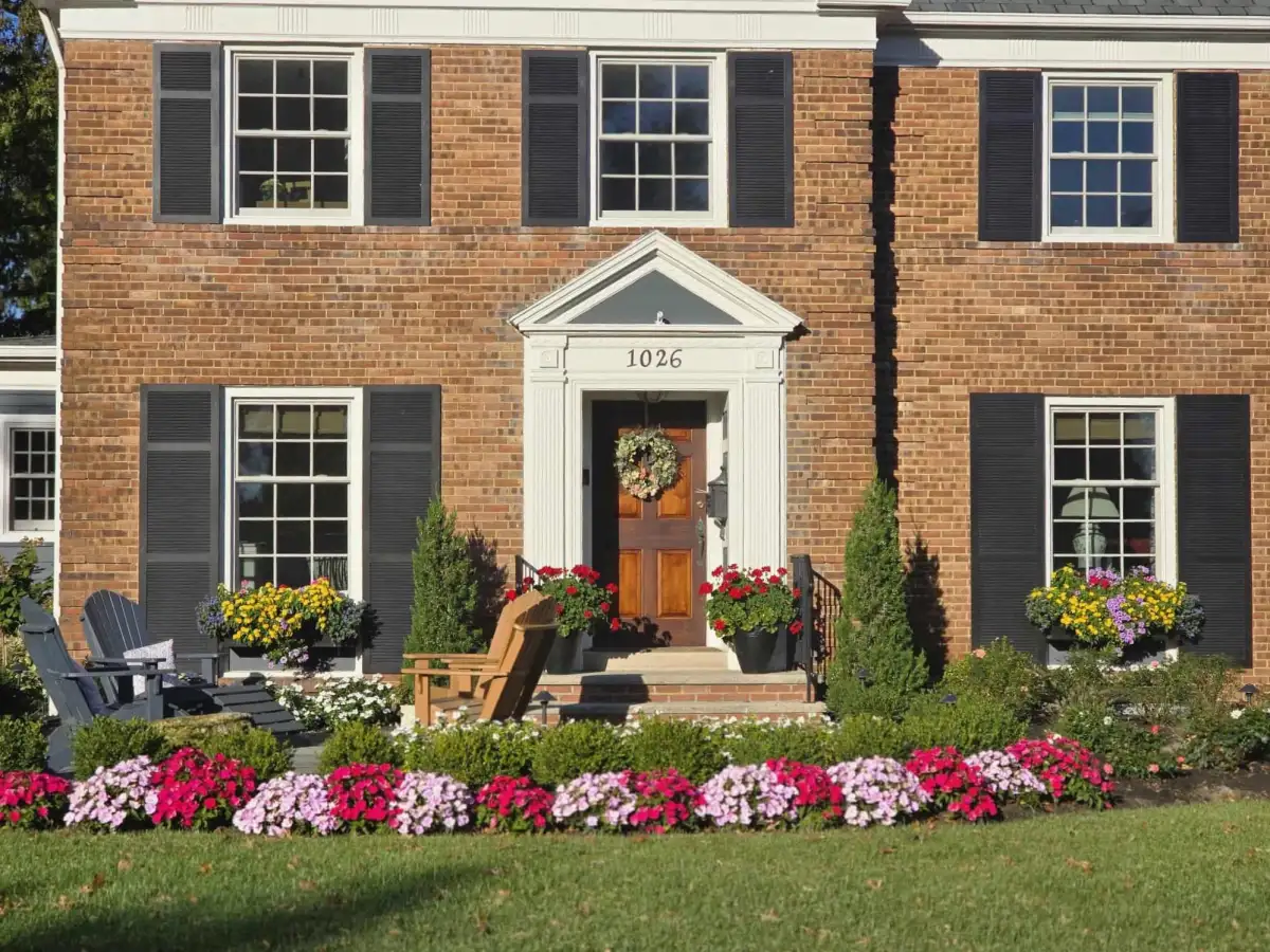 Custom landscape design with colorful flower beds and foundation plantings