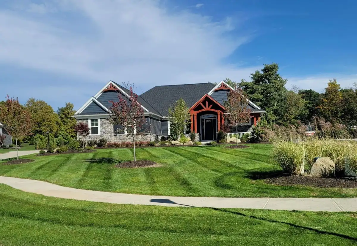 Craftsman home with professional striped lawn