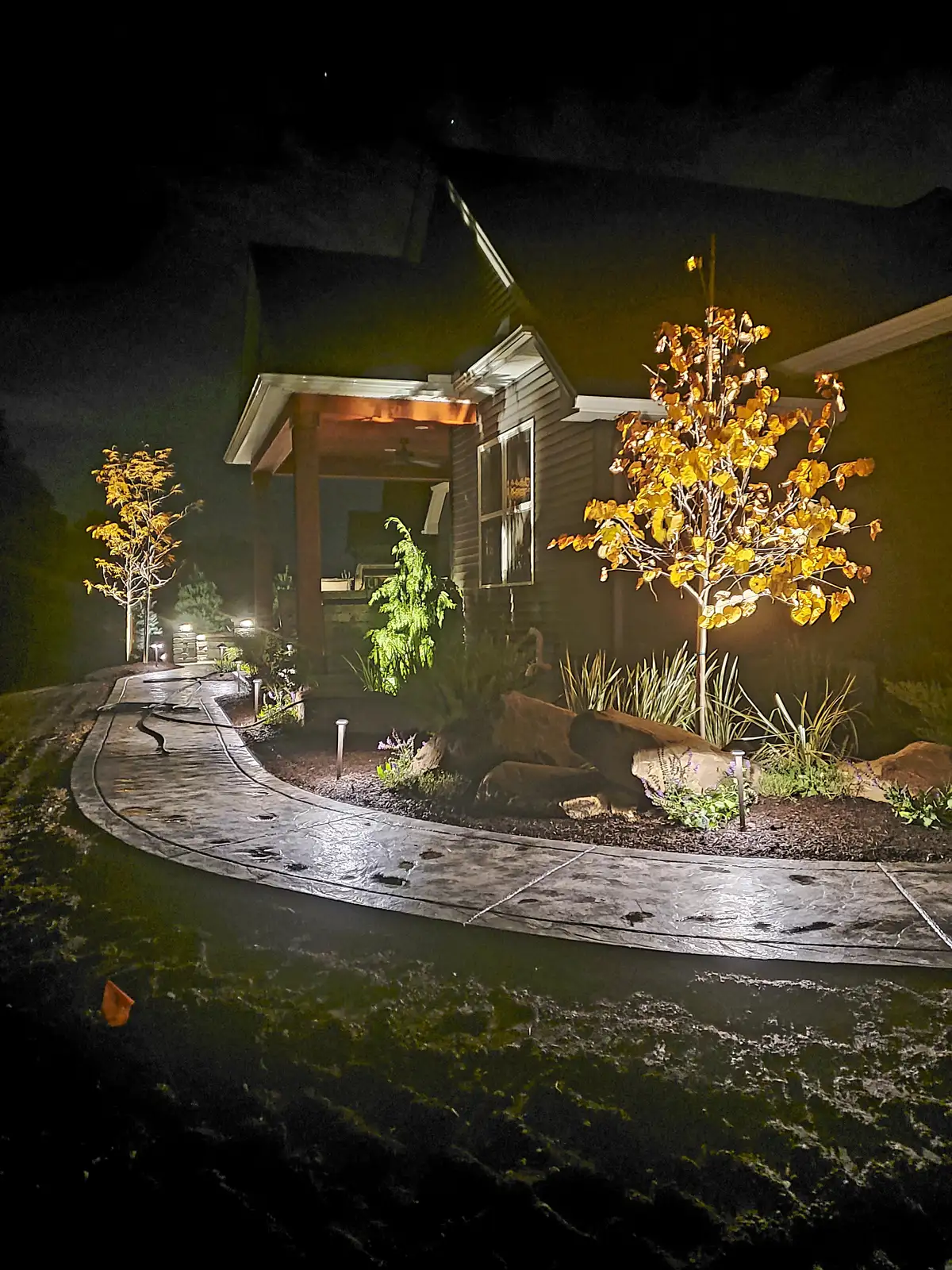 Backyard lighting with pergola and patio
