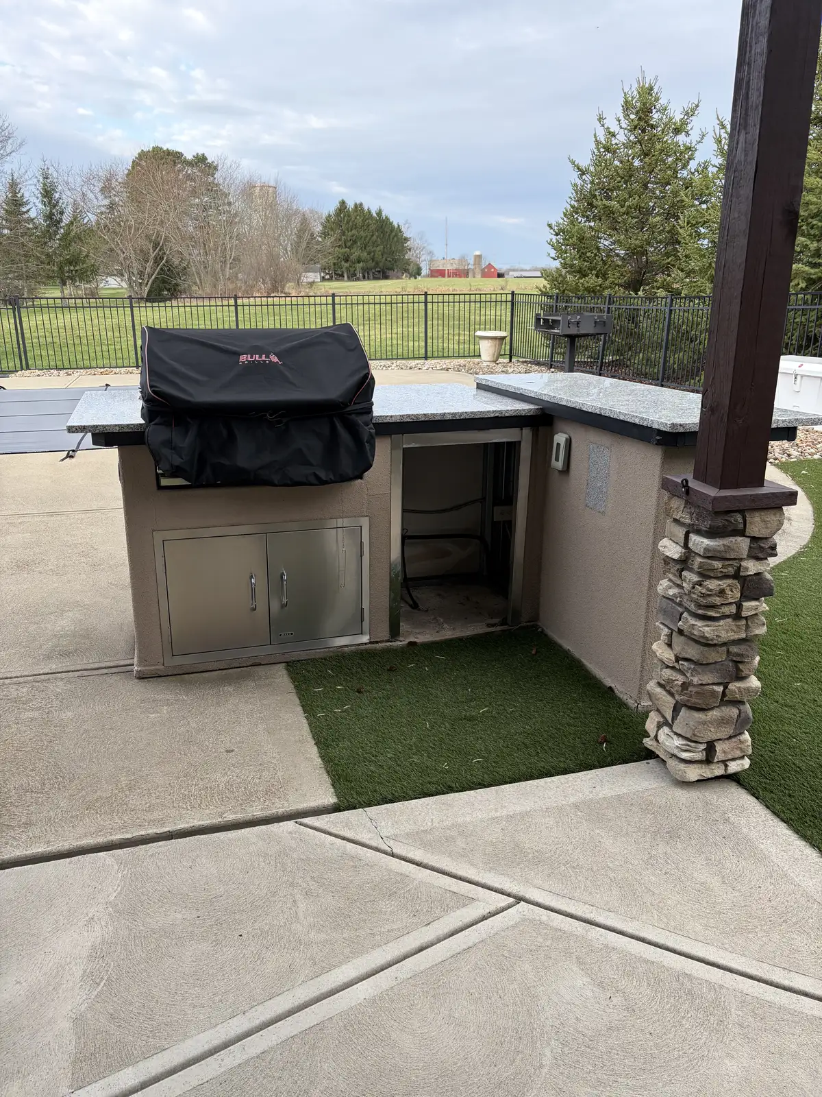 Stone outdoor kitchen and patio construction detail