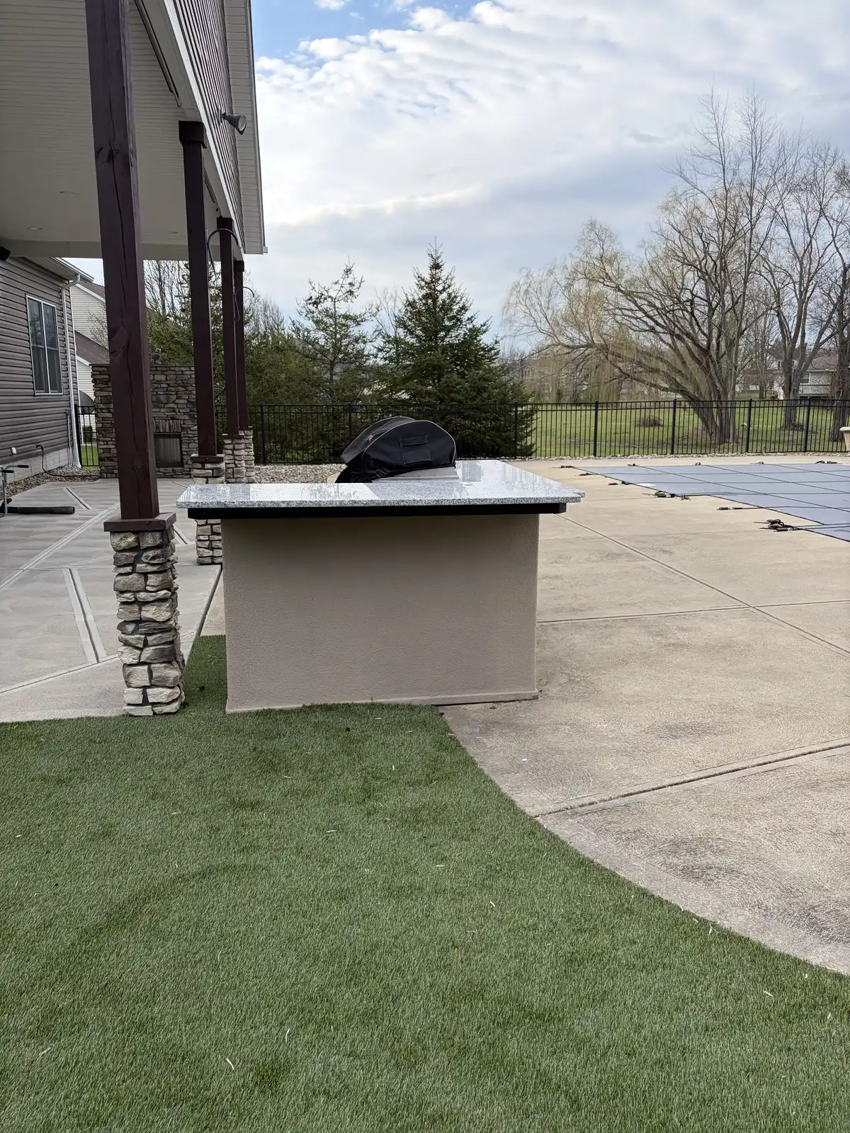 Stone outdoor kitchen and patio construction detail