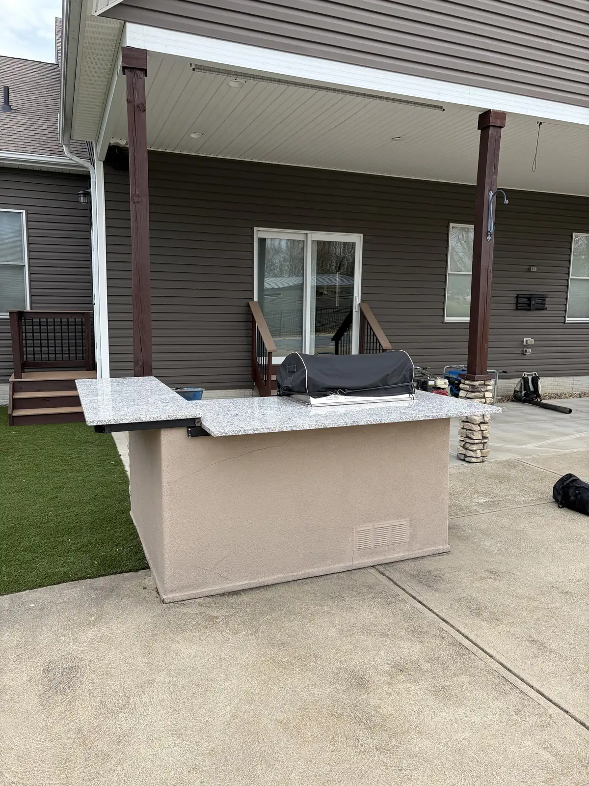 Stone outdoor kitchen and patio construction detail