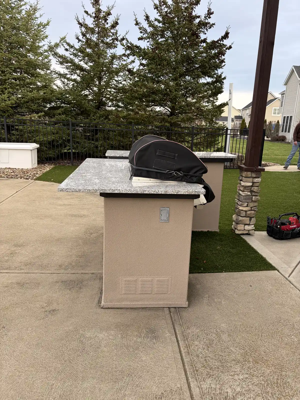 Stone outdoor kitchen and patio construction detail