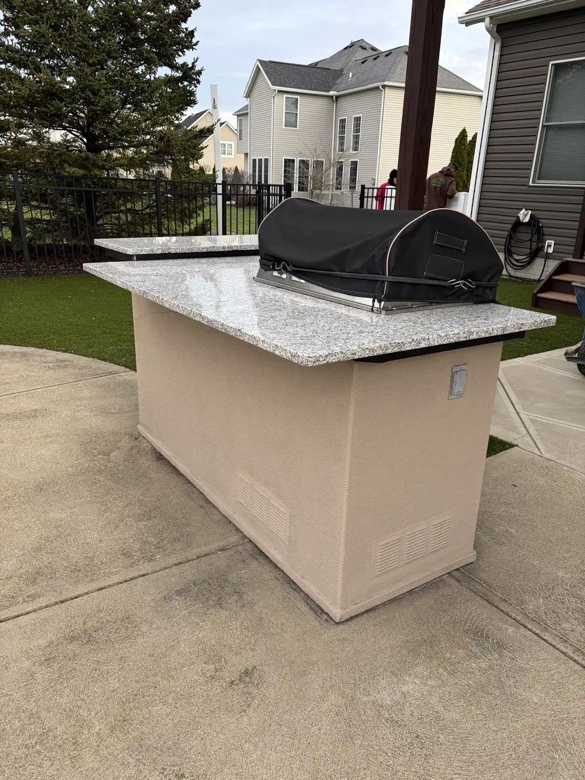 Stone outdoor kitchen and patio construction detail