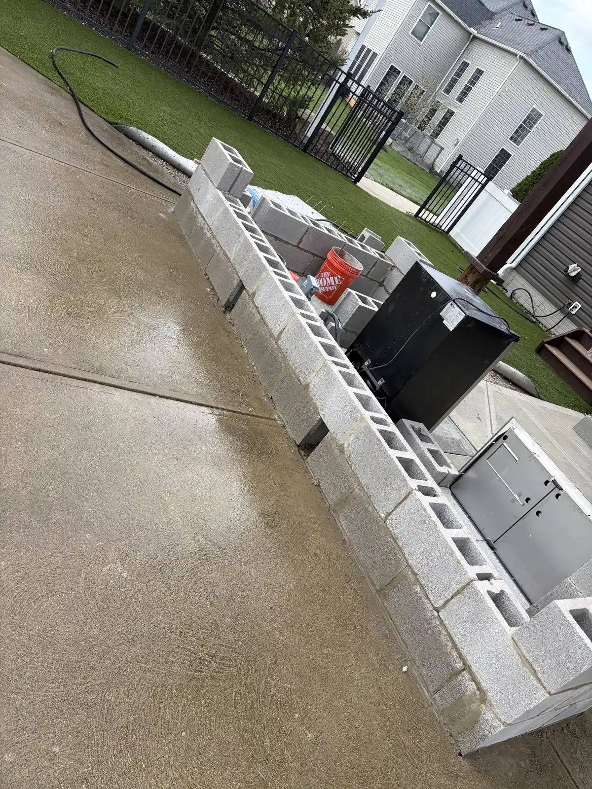 Stone outdoor kitchen and patio construction detail