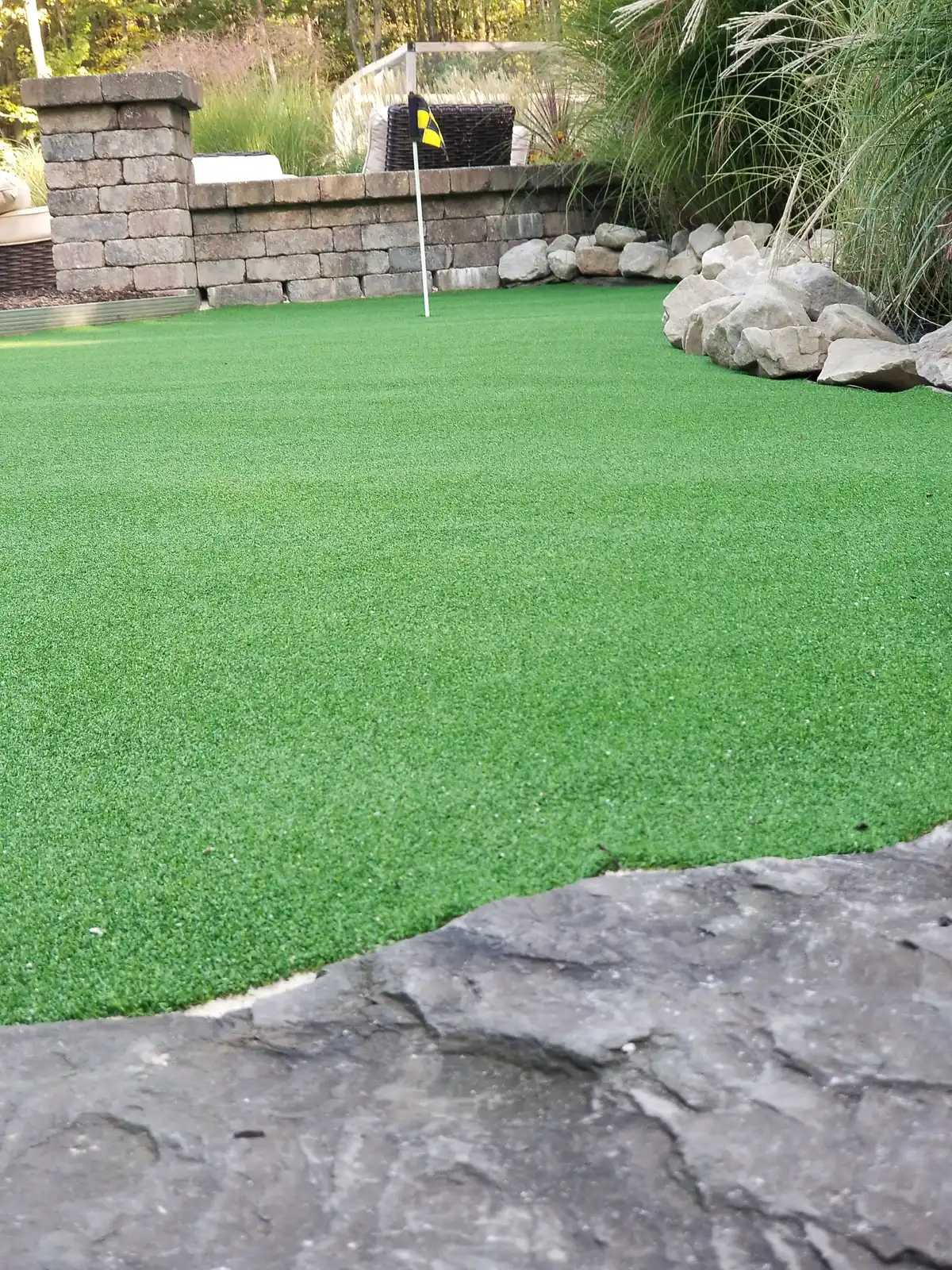 Synthetic turf backyard with landscaping border
